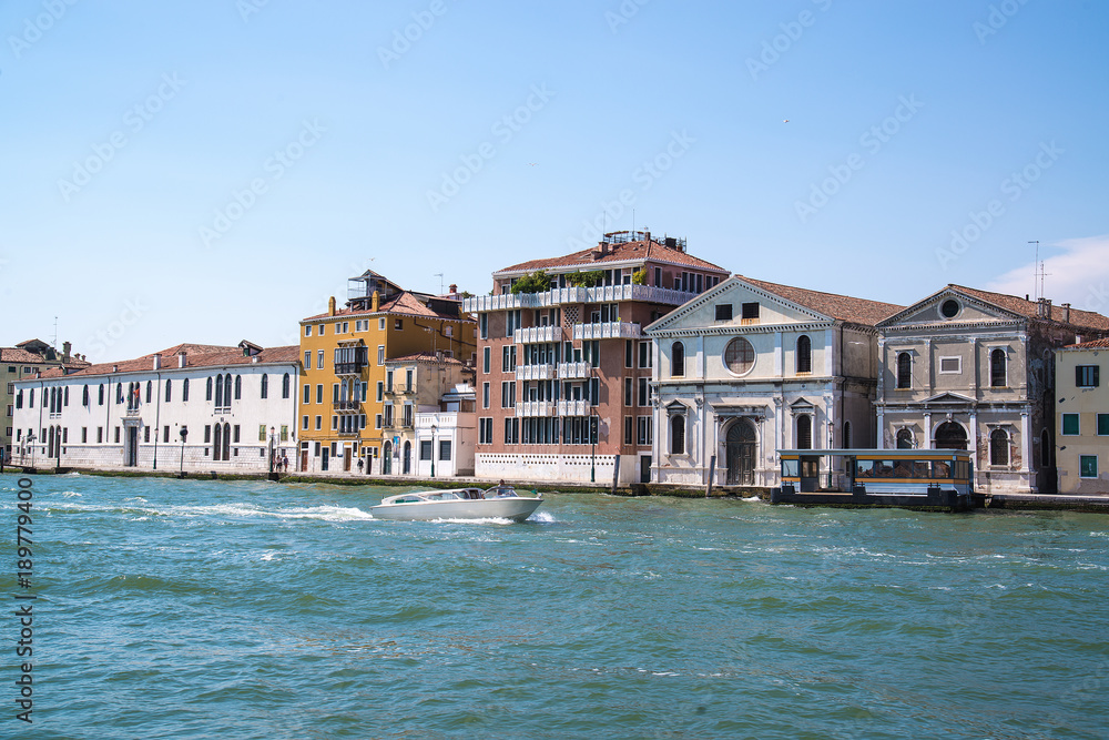 View of the beautiful architecture and boat along canals in Venice, Italy