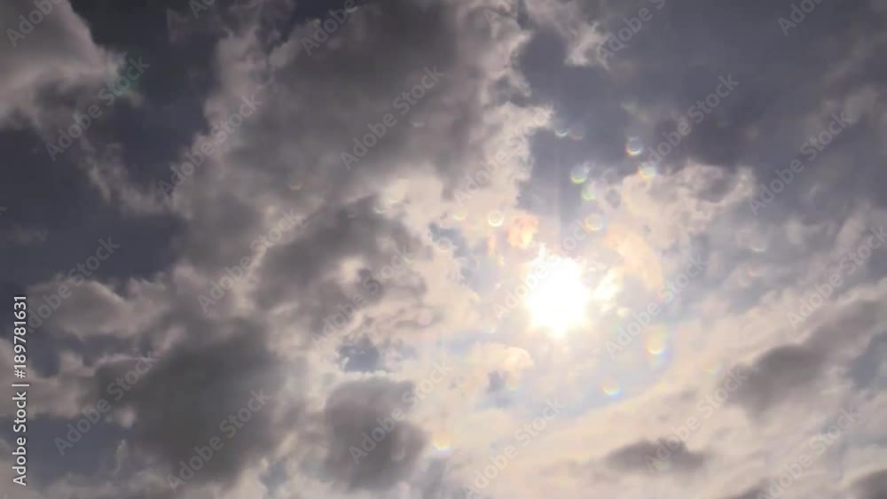 Timelapse of clouds with sun shining through Timelapse of clouds with sun shining through