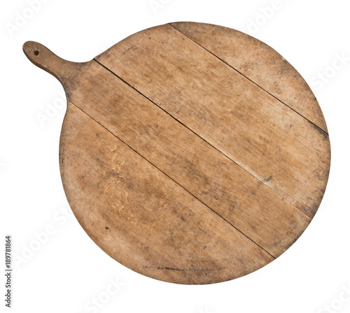 Old wood kitchen cutting board isolated on white. Round, with handle.
