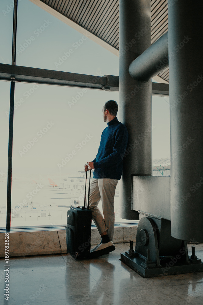 Man with suitcase at the airport