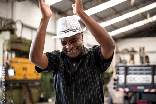 Aged Man Playing Samba with Hands photo