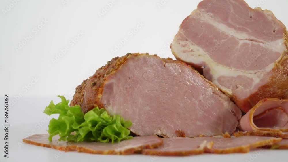Sliced processed meat products on white background. Smoked pork bacon Sliced processed meat products on white background. Smoked pork bacon