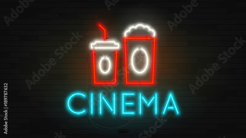 Realistic neon cinema billboard template. Retro shining color banner on brick wall. Concept of advertising for movie theater with glowing text.