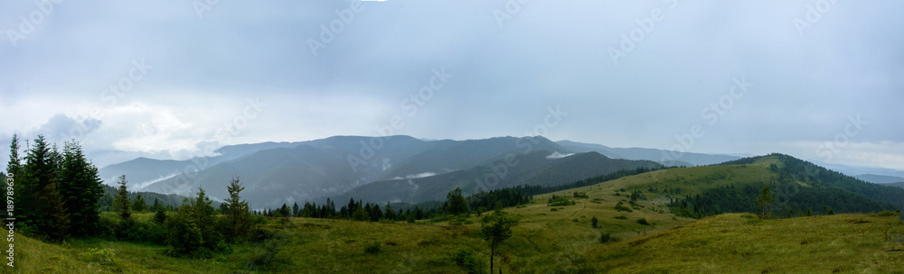 Amazing panorama on the mountain Yavorinka in the Carpathians during the rain