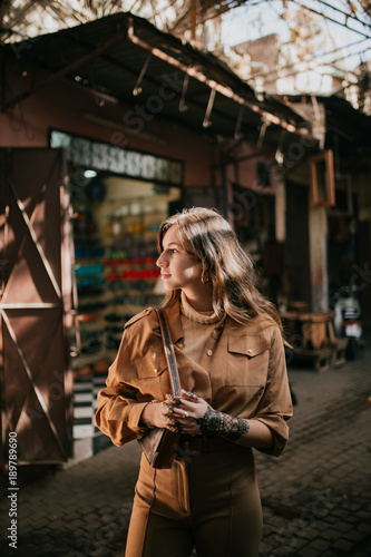 Young female tourist in a Muslim neighborhood