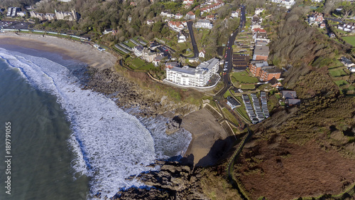 Editorial SWANSEA, UK - JANUARY 26, 2018: Ariel view of a small section of the Wales Coastal Path as it winds its way past Rotherslade Bay and Langland Bay on the Gower peninsula in Swansea photo