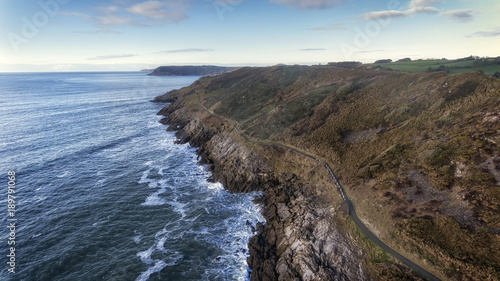 Editorial SWANSEA, UK - JANUARY 26, 2018: Wales Coastal Path, a long-distance footpath which runs along the majority of the coastline of Wales seen here as it stretches from Langland Bay to Caswell