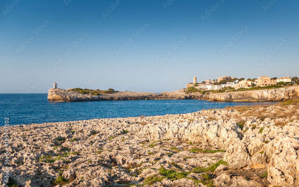 Lighthouse on the rocky coast of the Spanish island of Mallorca, Europe.