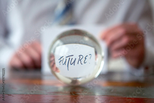Canvas-taulu man holding paper with the word Future in front of glass ball