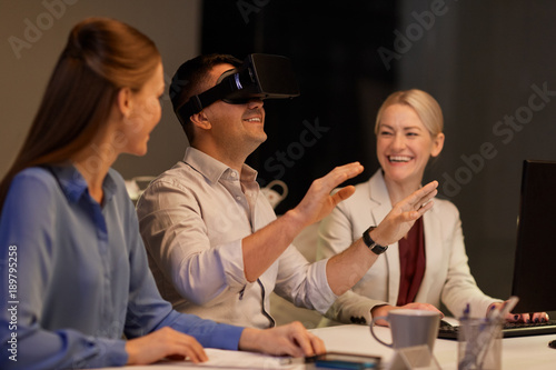 business team with computer working late at office