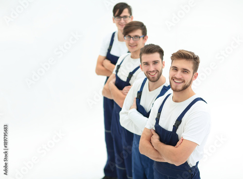 Cheerful team of responsible movers isolated on white background