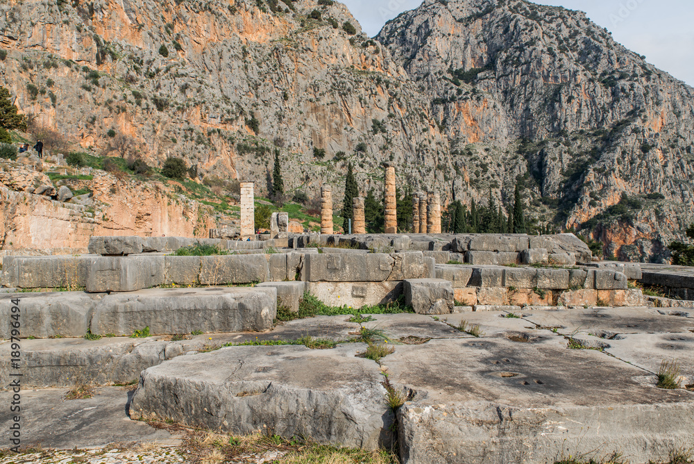 Apollo Temple in Delphi and ancient theatre, an archaeological site in Greece, at the Mount Parnassus. Delphi is famous by the oracle at the sanctuary dedicated to Apollo. UNESCO World heritage