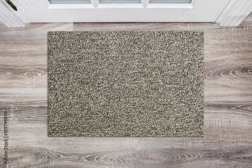 Blank beige woolen doormat before the white door in the hall. Mat on wooden floor, product Mockup