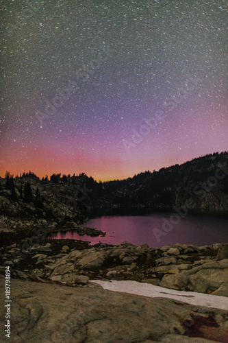 northern lights above mountain lake