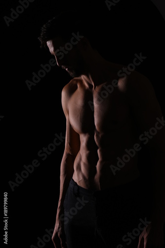 Fitness model silhouette on black background