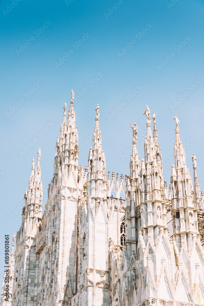 Marble statues of Saints on the spires of the Milan Cathedral Duomo di Milano in Milan Lombardy, Italy