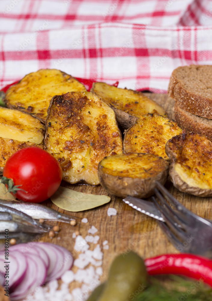 Baked potatoes with anchovies, pickled cucumbers, onions, black bread, tomatoes, chili peppers. Baked potatoes with anchovies, pickled cucumbers, onions, black bread, tomatoes, chili peppers.