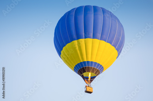 Colorful of hot air balloon with fire and blue sky background