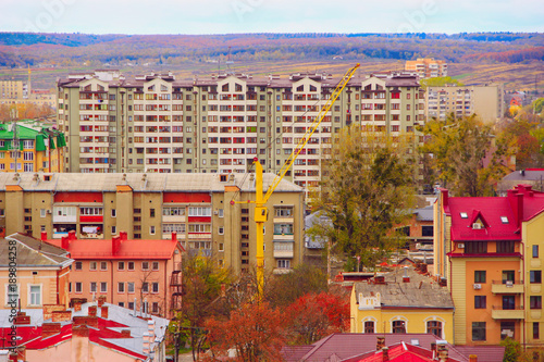 Panorama of city with multystorey houses photo