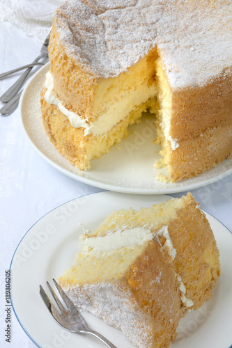 Cream Sponge Cake with Slice Cut out for Serving