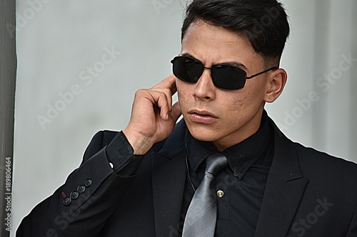 Unemotional Handsome Person Wearing Sunglasses photo