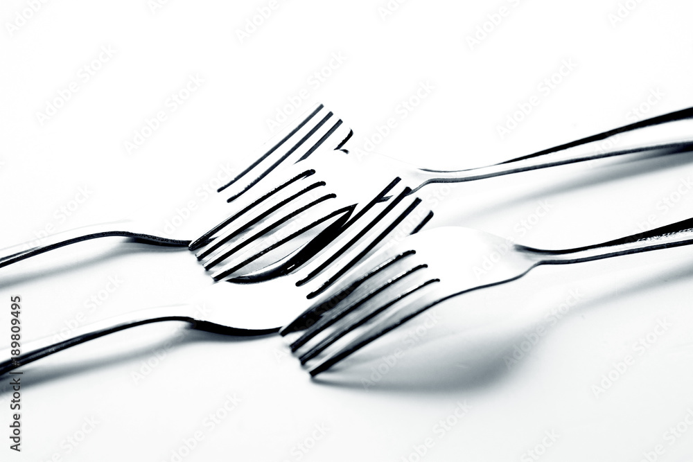 Fork background / A fork, in cutlery or kitchenware, is a tool consisting of a handle with several narrow tines on one end. Fork background / A fork, in cutlery or kitchenware, is a tool consisting of a handle with several narrow tines on one end.