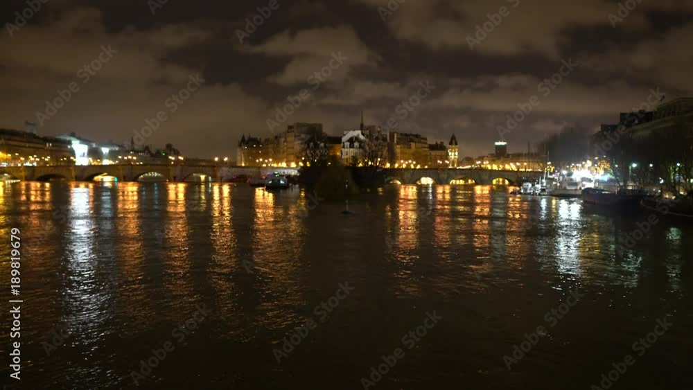 Paris,France-January 26, 2018:View of the Saine river, Cite island and Pont Neuf from Pont des Arts before sunrise Paris,France-January 26, 2018:View of the Saine river, Cite island and Pont Neuf from Pont des Arts before sunrise