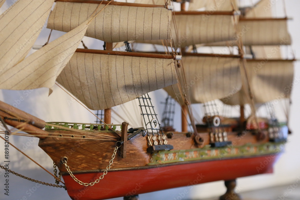 Scene of the ornament of the model of the sailing boat displayed on the shelf of the room