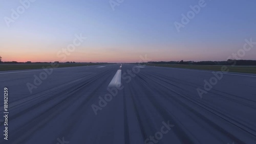 Airplane accelerates over the runway - POV