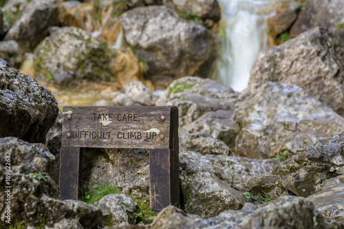 Sign: Take care difficult climb up, seen at the Gordale Scar near Malham in the Yorkshire Dales, North Yorkshire, UK