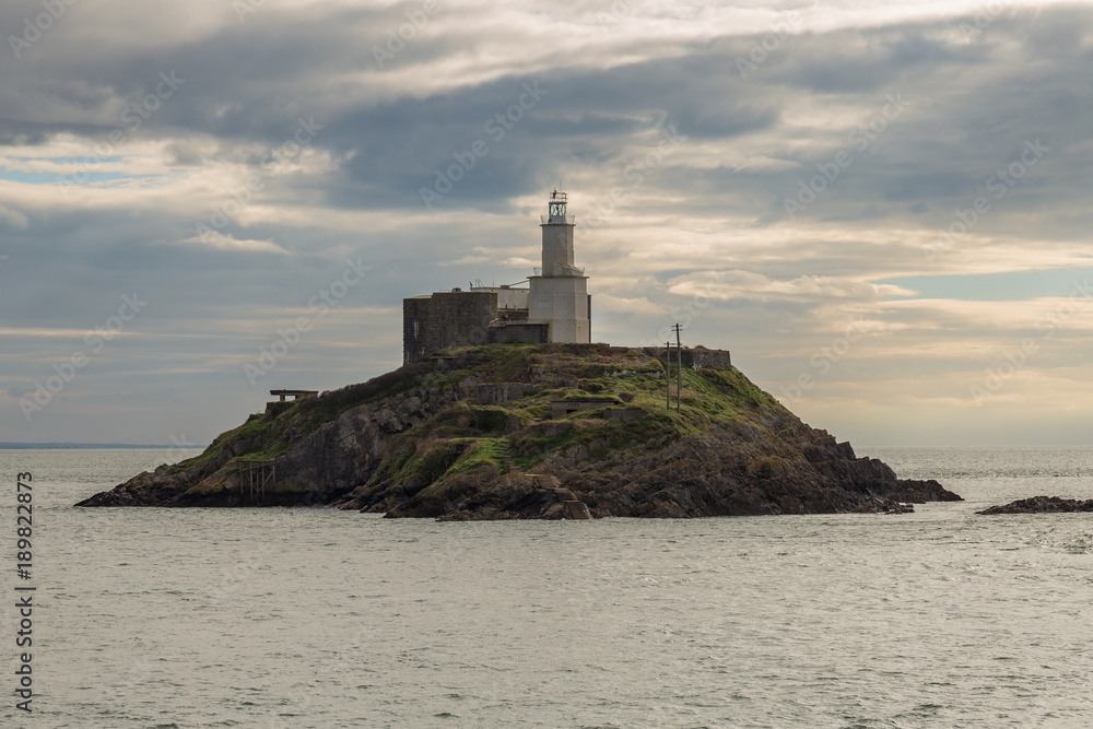 A cloudy day at Mumbles Head Lighthouse in Swansea, Wales, UK