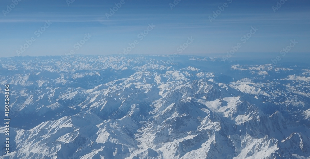 Aerial view of the Alps in Europe during winter season with fresh snow