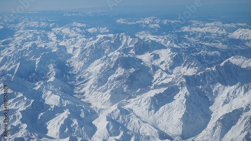 Aerial view of the Alps in Europe during winter season with fresh snow