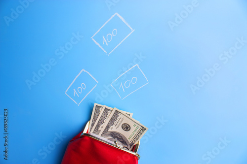 red leather wallet with money photo