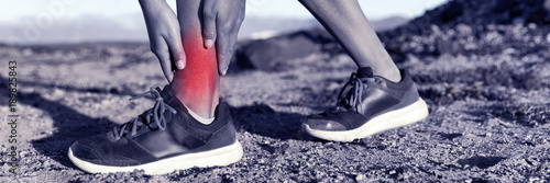 Medical health injury runner woman with hurting twisted ankle. Sports injury fitness athlete with red inflamed pain. Panorama banner.