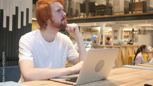 Thinking, Brainstorming Redhead Beard ManWorking in Cafe photo