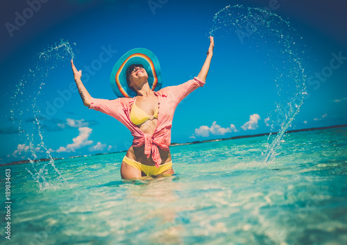Woman in bikini having fun in an ocean