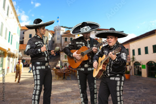 Mexican musicians mariachi on a city street