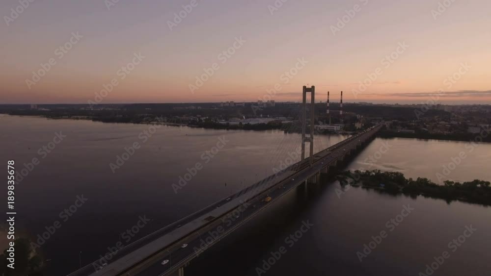 Bridge with trafic over the river at sunset aerial drone footage Bridge with trafic over the river at sunset aerial drone footage