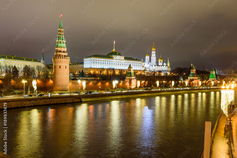 Illuminated Moscow Kremlin and Moscow river in winter evening, Russia