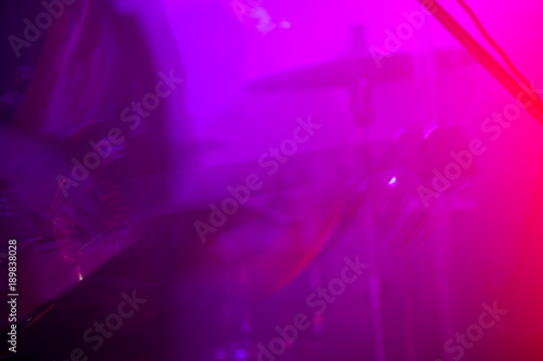 Photography Blurred electric guitar player on a stage