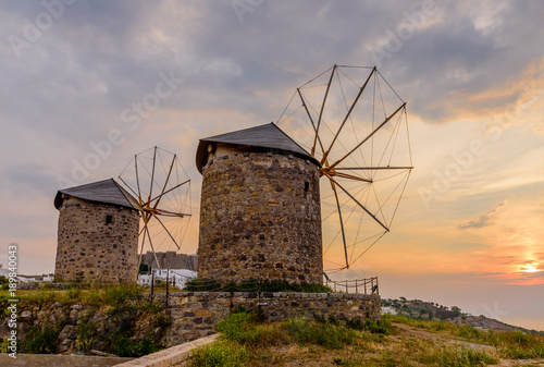 Beautiful sunset. View of the island of Patmos with windmills, Greece.