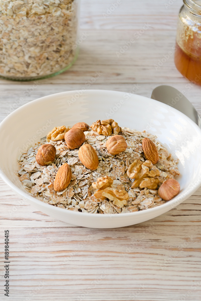 Bowl of muesli and nuts with honey. Bowl of muesli and nuts with honey.