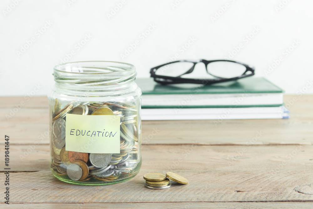 Coins in jar with Education label Coins in jar with Education label