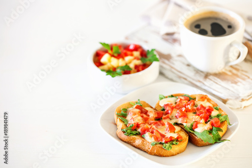  bruschetta with tomatoes, mozzarella cheese and herbs