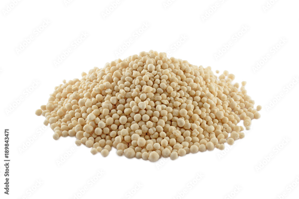 Heap of composite mineral fertilizers, isolated on white Heap of composite mineral fertilizers, isolated on white
