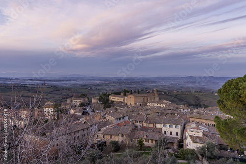 Aerial view of San Gimignano and the Church of Sant'Agostino at sunset, Siena, Tuscany, Italy