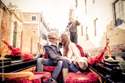 Couple sailing on venetian gondola © oneinchpunch