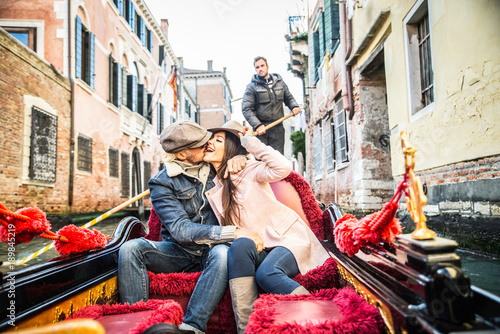 Couple sailing on venetian gondola © oneinchpunch