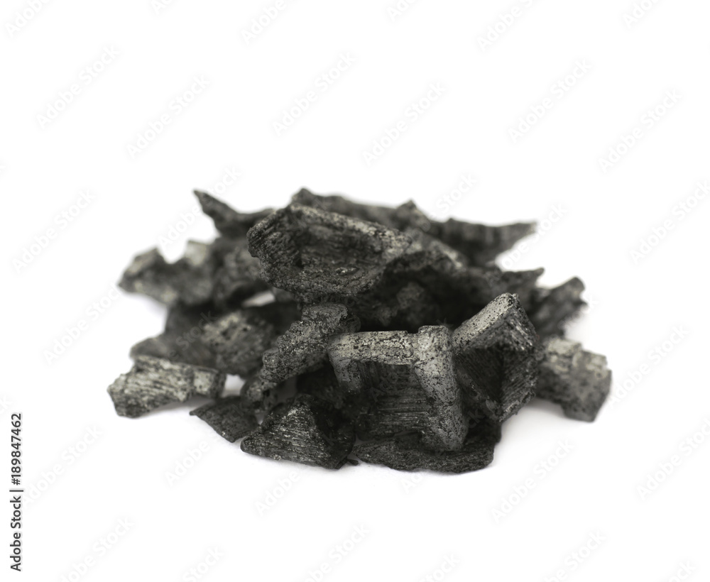 Pile of black salt crystals isolated Pile of black salt crystals isolated